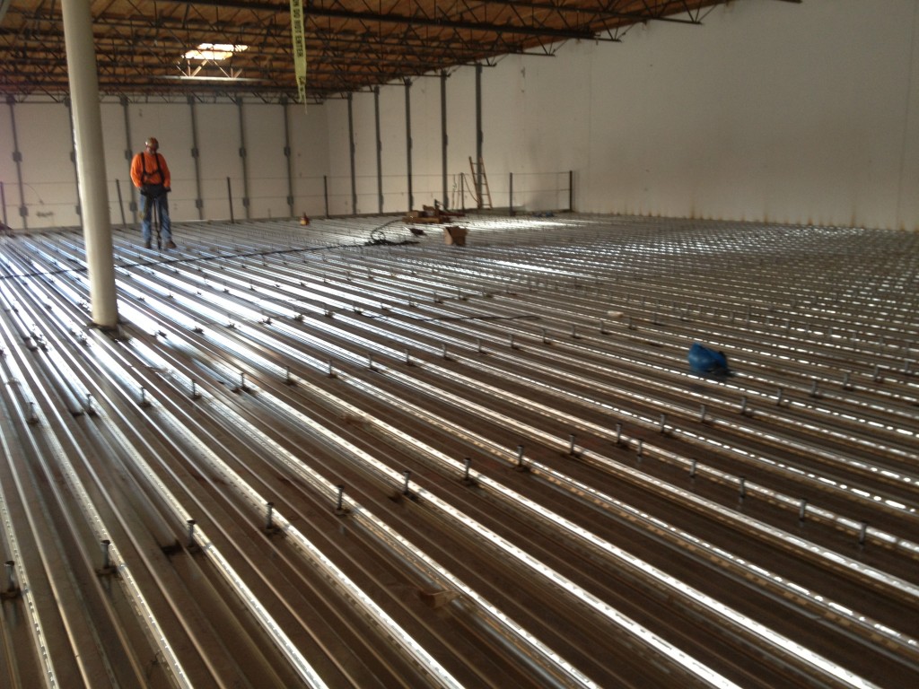 Steel decking installation inside a large warehouse