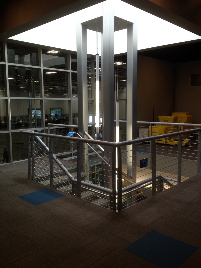 Interior stairway with steel railing and structural columns