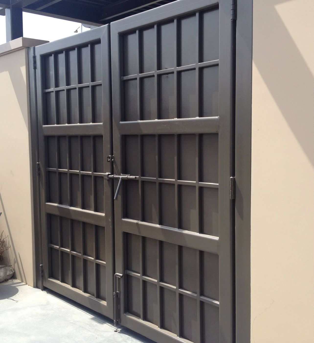 Double steel gate fabricated for a trash enclosure