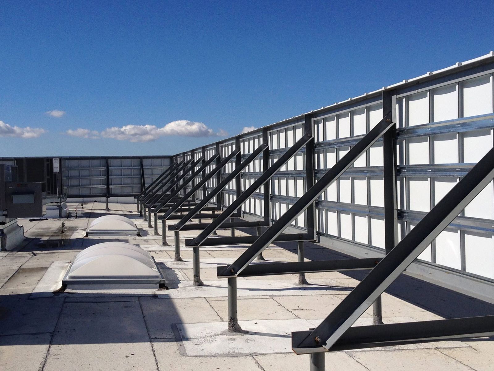 Rooftop equipment screen framing on a commercial roof